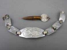 Aluminium trench art bracelet dated 1944 'Do Not Forget Me' and a bullet pendant mounted with a 1918