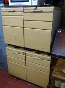 Four matching light wood and metal sets of office file drawers
