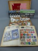Small part filled album and booklet of stamps, an unsorted boxed quantity and two sets of Royal Mint