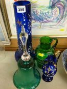Bristol blue glass vase and a small similar gilt decorated jug, a green glass hand bell and a