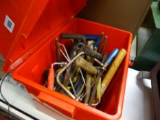 Plastic red container with various hand tools