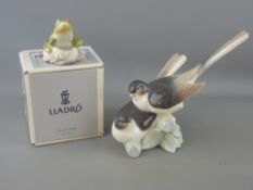Two Lladro porcelain figurines including a pair of doves and a boxed model of a frog