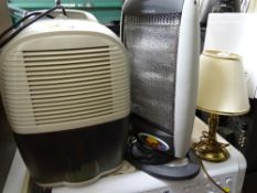 Delonghi DEM10 dehumidifier, small halogen electric heater and a brass effect lamp E/T