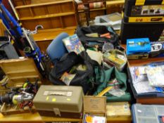 Large parcel of fishing equipment including rods, reels in approximately eight assorted bags