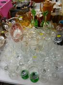 Pair of decorative green glass jugs, selection of drinks ware, bobble pattern globular vase etc