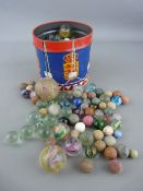 Collection of vintage glass and stone marbles in varying degrees of play worn condition