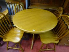 Modern light oak effect circular dining table and four stickback chairs