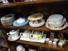 Two shelves (top and middle) of mixed china and pottery including eggshell coffee set