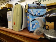 Proline Fastset 600 microwave oven, Safeshred S5 paper shredder, Hometek steam cleaning system and