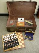 Vintage suitcase and contents including a modern chess set, set of balance scales etc