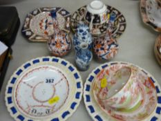 Pair of small Imari bottle vases, two blue and white Oriental vessels, two ribbon plates and a