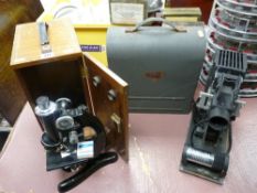 Beck of London vintage laboratory microscope in a wooden case and a cased vintage AMP projector