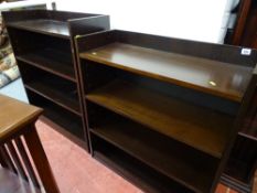 Two sets of dark wood bookshelves with adjustable interior shelves