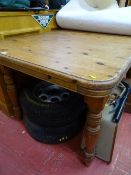 Antique pine style extending dining table on turned supports