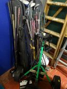 Electric golf buggy with battery (no charger) and a very large quantity of golf clubs E/T