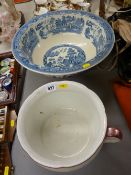 Willow pattern pottery washbowl and a lustre decorated chamber pot