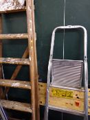 Parcel of wooden and metal stepladders, Black & Decker workbench, garden table, two chairs and a