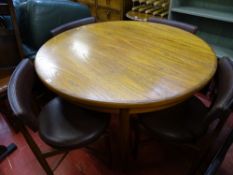 G-Plan crossbanded teak circular extending dining table and four matching dining chairs