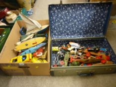 Box of vintage pond yachts, toy submarines and vehicles along with a vintage suitcase of toy