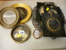 Two framed Victorian silhouettes, an additional frame and two cast examples, a small circular gilt