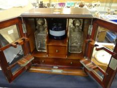 An inlaid two-door glazed smoker's cabinet