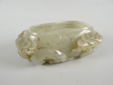 A carved jade brush pot, 11.4cms long Condition reports are provided on request by email only for