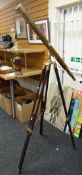 A vintage telescope on a tripod stand Condition reports are provided on request by email only for