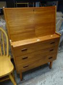 A mid-century teak bureau with three drawers & four front Condition reports are provided on