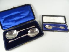 A cased christening spoon with Humpty Dumpty character finial together with a cased pair of