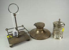 A square based silver four-bottle stand together with a hallmarked silver circular based inkwell &