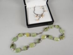 A seed pearl droplet necklace and a possibly green-jade and silver bead necklet