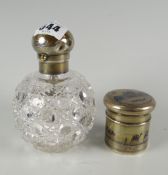 A silver topped scent bottle with screw top & hobnail cut bulbous body together with an Eastern