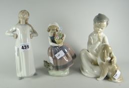 A Lladro figure of a child in nightdress with puppy & two further infant Lladro figures Condition