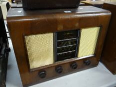 A Bush vintage veneer encased radio Condition reports are provided on request by email only for this