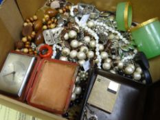 A quantity of costume beads & a yellow metal compact travel clock ETC Condition reports are provided
