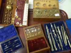 A parcel of vintage cased drawing sets & weights Condition reports are provided on request by
