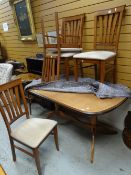 A modern extending dining table & four chairs Condition reports are provided on request by email