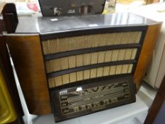 A Regentone veneer & Bakelite Art Deco period radio Condition reports are provided on request by