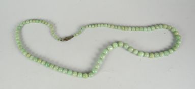 A strand of jade beads Condition reports are provided on request by email only for this type of