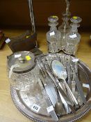 A three-bottle EPNS decanter caddy with bottles, quantity of loose cutlery, EPNS tray ETC