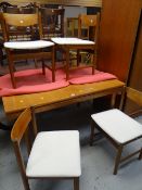 A G-Plan or style mid-century lightwood extending dining table & four matching chairs Condition