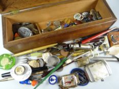 A wooden box containing small collectables including whistle, badges, pens ETC Condition reports are