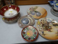 A pair of Royal Doulton series ware chargers, three small Adams pottery Oliver Twist platters, a