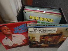 A box of vinyl records including Max Boyce, Jim Reeves, Shirley Bassey & other Welsh themed