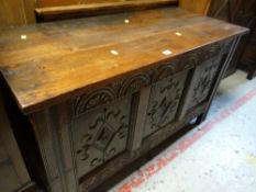 A carved antique coffer blanket chest with later top Condition reports are provided on request by