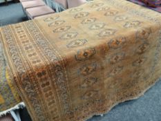 Rust ground antique Persian carpet with geometric motif patterns, 221 x 149cms