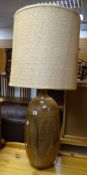 A mid to late twentieth century oversized sgraffito pottery table lamp with shade Condition