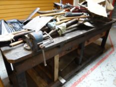 A characterful vintage workbench with mounted vice, lower tier & drawer Condition reports are