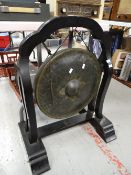 An Eastern-style dinner gong & stand Condition reports are provided on request by email only for