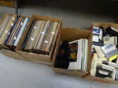 A collection of vinyl records, cassette tapes & books Condition reports are provided on request by